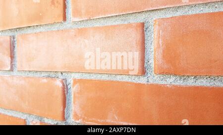 Orange brick wall. Close up perspective view. Stock Photo