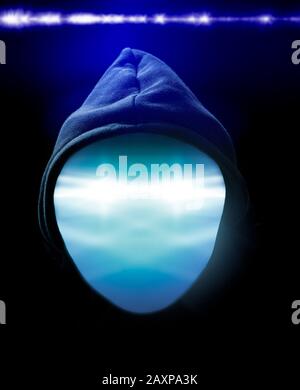 Faceless hooded anonymous computer hacker Stock Photo