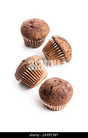 Sweet muffins. Cupcakes with chocolate isolated on white background. Stock Photo