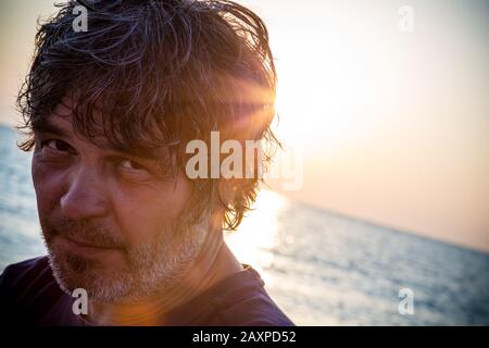 Handsome middle aged man close-up portrait / Sunset. Copy Space Stock Photo
