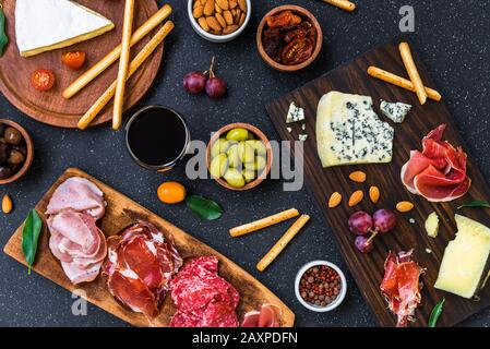 Table of antipasti and appetizers with cold meats and cheese deli platter. Stock Photo