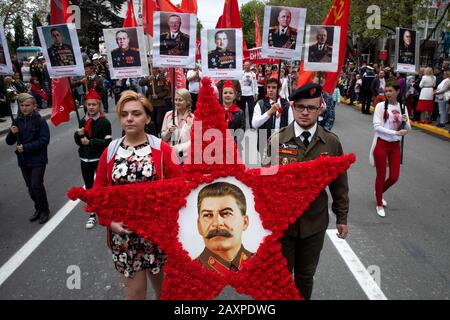 Sevastopol, Crimea, 9th of May, 2019 Communist party members take part in a march marking the 74th anniversary of the Victory over Nazi Germany in the 1941-1945 Great Patriotic War, the Eastern Front of World War II.s Stock Photo