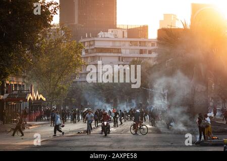 Protesters on the streets around Plaza de Italia during recent demonstrations in Santiago, Chile. Stock Photo