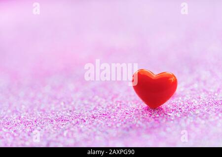 Valentines Day background with Red heart shapes on abstract light pink glitter background, Copy space Stock Photo