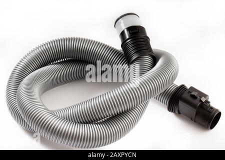Black plastic pipe from a vacuum cleaner on a white background. Stock Photo