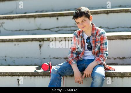 Smart casual wearing teen posing outdoors Stock Photo