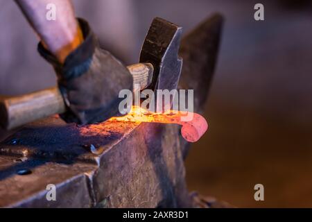 Pernes-les-Fontaines, Vaucluse, Provence-Alpes-Cote d'Azur, France. Anvil in the smithy La Forge Stock Photo