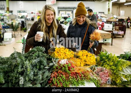 Chicago, USA. 12th Feb, 2020. Customers select flowers at a floral wholesale market in Chicago, the United States, on Feb. 12, 2020. With Valentine's Day being one of their busiest weeks of the year, employees of floral wholesale markets in Chicago work hard to meet the demand of customers. Credit: Joel Lerner/Xinhua/Alamy Live News Stock Photo