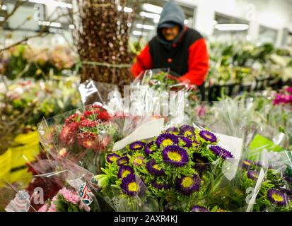 Chicago, USA. 12th Feb, 2020. An employee prepares flowers for Valentine's Day at a floral wholesale market in Chicago, the United States, on Feb. 12, 2020. With Valentine's Day being one of their busiest weeks of the year, employees of floral wholesale markets in Chicago work hard to meet the demand of customers. Credit: Joel Lerner/Xinhua/Alamy Live News Stock Photo