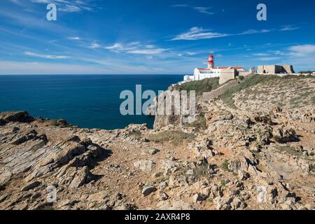 Lighthouse at the Cape of Sao Vicente at the most south-western point of mainland Europe, Costa Vicentina, Sagres, Algarve, Faro district, Portugal Stock Photo