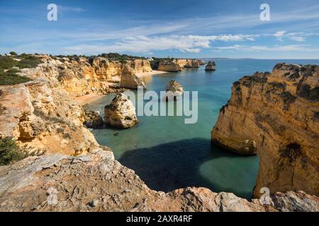 Rocky coast at Praia da Marinha near Benagil, Algarve, Faro district, Portugal Stock Photo