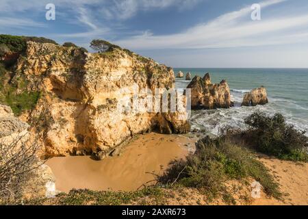 Rocky coast at Praia da Prainha, Alvor, Algarve, Faro district, Portugal Stock Photo