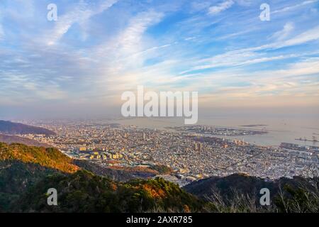 Kobe city panoramic view from Mt. Maya Kikusedai park observatory platform in sunny day sunset time with blue sky background Stock Photo