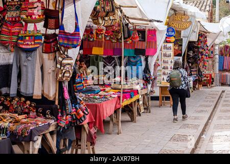 Peru market, Sunday market at town of Pisac, vendors, locals, tourists at the city of Pisac market, Peru Sacred Valley Peru Stock Photo