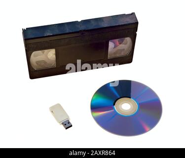 Examples of how recording media and technology have changed over time. First came the Video Tape recorder. Then came the DVD recorder. Now videos and Stock Photo