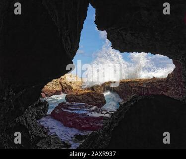 Cave limestone formations looking out to the ocean on the coast of Niue. Stock Photo
