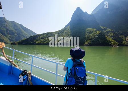 Woman on ferry, Koman Reservoir, Liqeni i Komanit, River Drin, Qark Shkodra, Albania Stock Photo