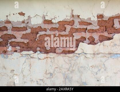 Peeling, chipped paint on an adobe building Stock Photo