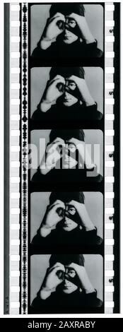 1964 , GREAT BRITAIN : Film cell strip with JOHN LENNON  from THE BEATLES movie A HARD DAY'S NIGHT ( 1964 - Tutti per uno ) by Richard Lester , cinematographed by Gilbert Taylor . Screenplay by Alun Owen . Distributed by United Artists . - FILM - MOVIE - CINEMA   FILM STRIP CELL - fotogramma - fotogrammi - pellicola cinematografica - banda sonora - POP - MUSICA ROCK - MUSIC - 60's - '60 - ANNI SESSANTA ---- NOT FOR ADVERTISING USE --- NON PER USO PUBBLICITARIO --- WARNING: This photograph can only be reproduced by publications in conjunction with the promotion of the above film. For Editorial Stock Photo