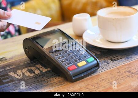 contactless payment by credit card at cafe Stock Photo