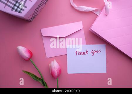 thank you note message and gift box on color background  Stock Photo