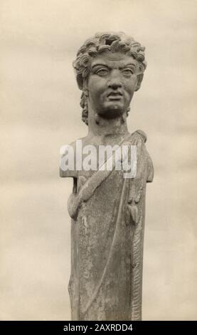 1930 ca , LAGO DI NEMI , Lazio , ITALY : The archeological interest site with discovery of ancient remains of the hull of one of the two roman ship by roman Emperor Caligula in the 1st century AD . Ornamental bronze Herm with human head of Divinity belonged to the Roman ship recovered , photo by Guido Bernardi , Genzano di Roma . Recovered from the lake bed in 1929 - 1932 , the ships were destroyed by Several shells of the United States Army hit the Museum around 8 pm, causing little damage but was the German Nazi to burn the Museum with fire during World War II in 1944 , the day 31 may . - bo Stock Photo