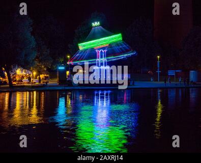 Summer festival in the Olympic Park with Olympic lake at night Munich, Bavaria, Germany, Europe Stock Photo