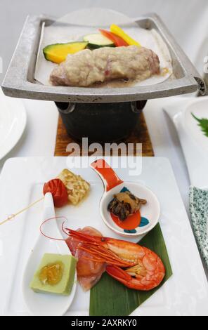 Kaiseki is a traditional multi-course Japanese dinner prepared by a chef with select seasonal ingredients. Stock Photo