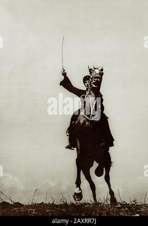 Red Army. From soviet propaganda book of 1937. Soviet cavalry. Red cossack with saber. Stock Photo