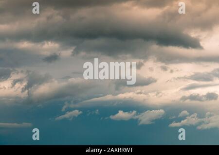 Background of sunset with clouds. Cloudscape under cinematic color filter. Stock Photo