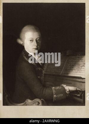 Portrait of Wolfgang Amadeus Mozart as a boy at the piano Half figure, sitting on Clavichord with inscription 'Veneti MDLXXXIII', open music booklet a Stock Photo