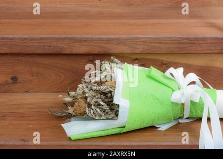 Withered roses on wood floor Stock Photo