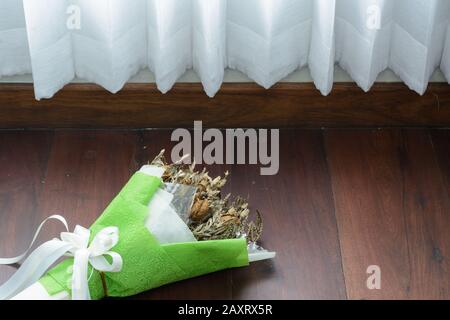 Withered roses on wood floor Stock Photo