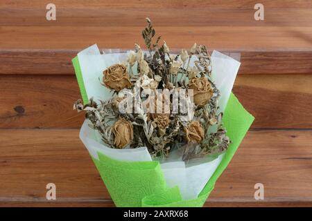 Withered roses on wood floor Stock Photo