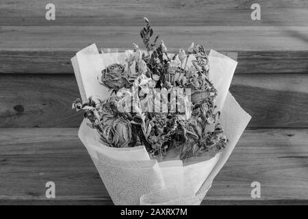 Withered roses on wood floor Stock Photo