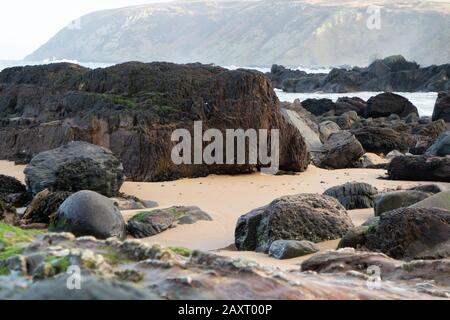 Kinnagoe bay in County Donegal, Inishowen has an extraordinary selection of colourful stones- Ireland. Stock Photo