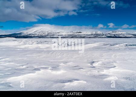 Sweden, Lapland, Torneträsk, snow and ice, view towards Rohkunborri National Park Stock Photo