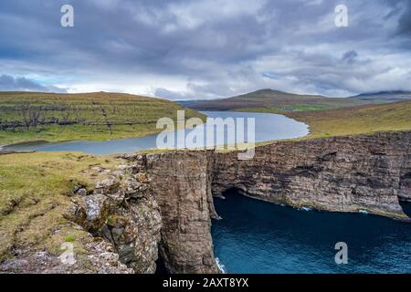 Sorvagsvatn lake cliffs over the ocean in Faroe Islands Stock Photo