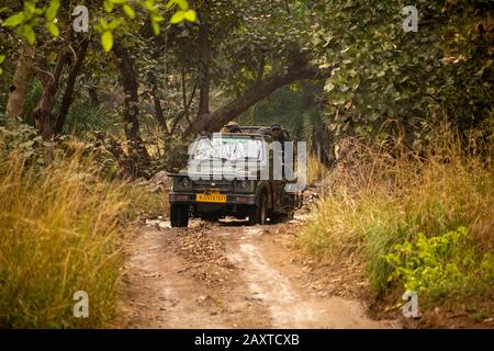 India, Rajasthan, Ranthambhore, National Park, Zone 2, Maruti Suzuki gypsy jeep on afternoon safari driving through stream Stock Photo