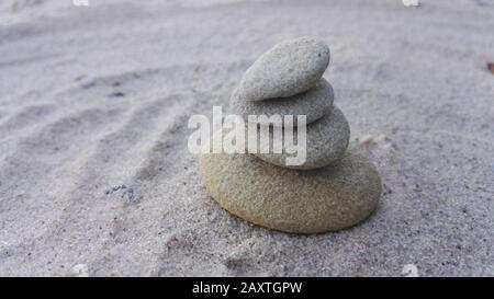 Close up zen stones and sand , relaxation and mindfulness concept Stock Photo