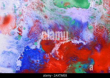 Multicolored paint stains, drips, splashes, mixing. Abstract background Stock Photo