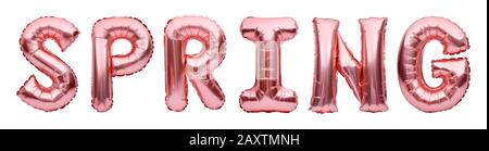 Pink golden word SPRING made of inflatable balloons isolated on white background. Rose gold foil balloon letters, party decorations. Stock Photo