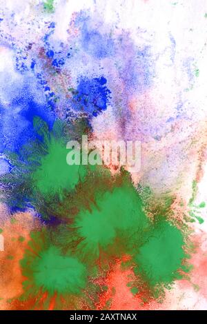 Mixing of paints of different colors on a white paper. Abstract colorful background, base Stock Photo