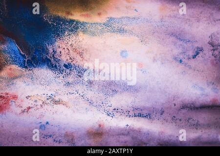 abstract ink spots of different colors on a white wet paper Stock Photo