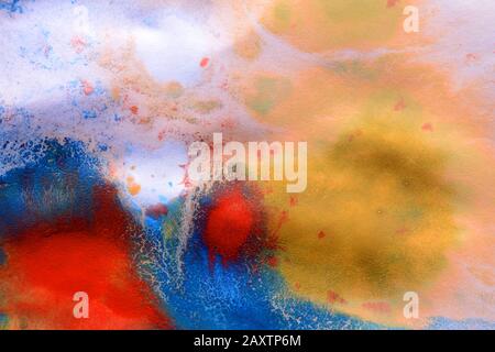 abstract ink spots of different colors on a white wet paper Stock Photo