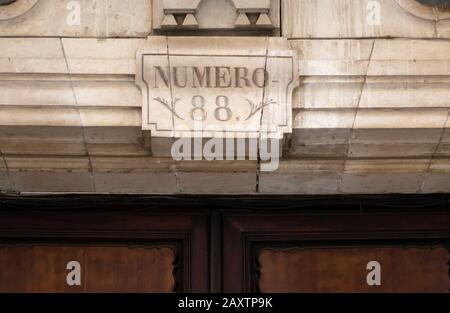 Number 88 sculpted on a stone in Spanish Stock Photo