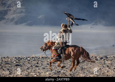 Kazakh berkut hunting western Mongolia Golden eagle festival horse riding Stock Photo