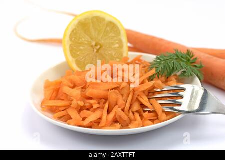 Grated carrots on a plate Stock Photo