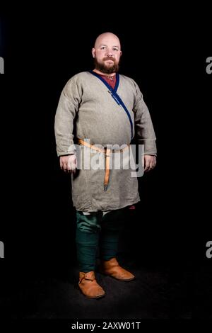Overweight bearded man in the image of a medieval merchant Stock Photo ...