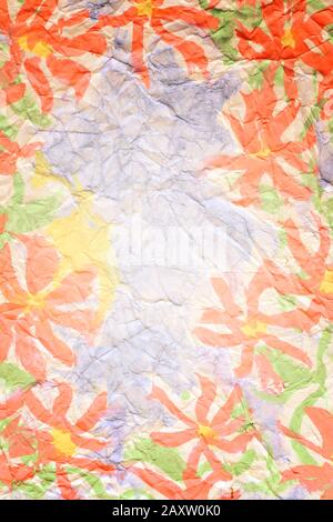 pink flowers painted paints on a crumpled blue paper Stock Photo